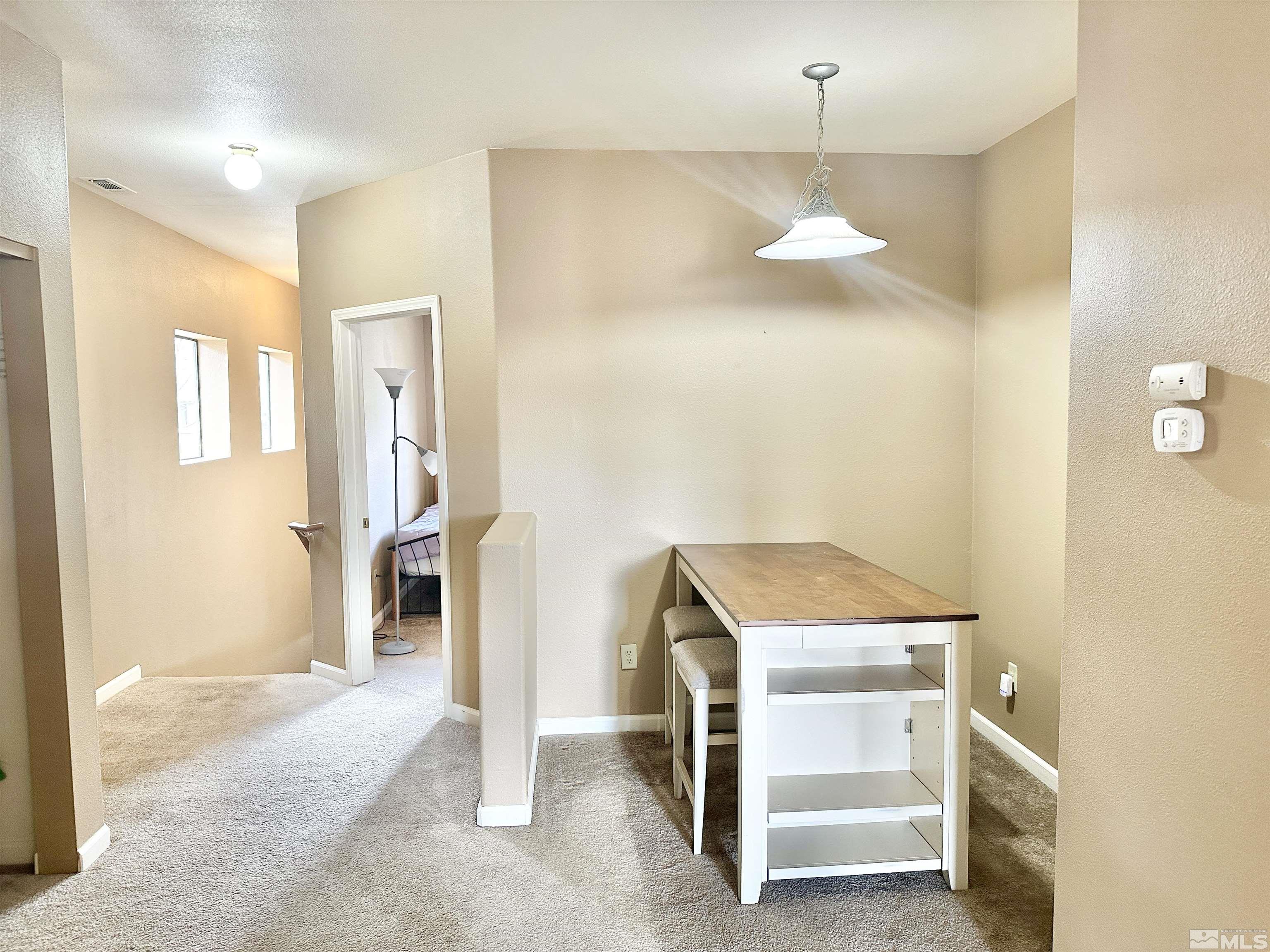 900 S Meadows, Unit 5122 Reno, NV 89521 - Photo 29 of 38 a bedroom with a bed and a ceiling fan
