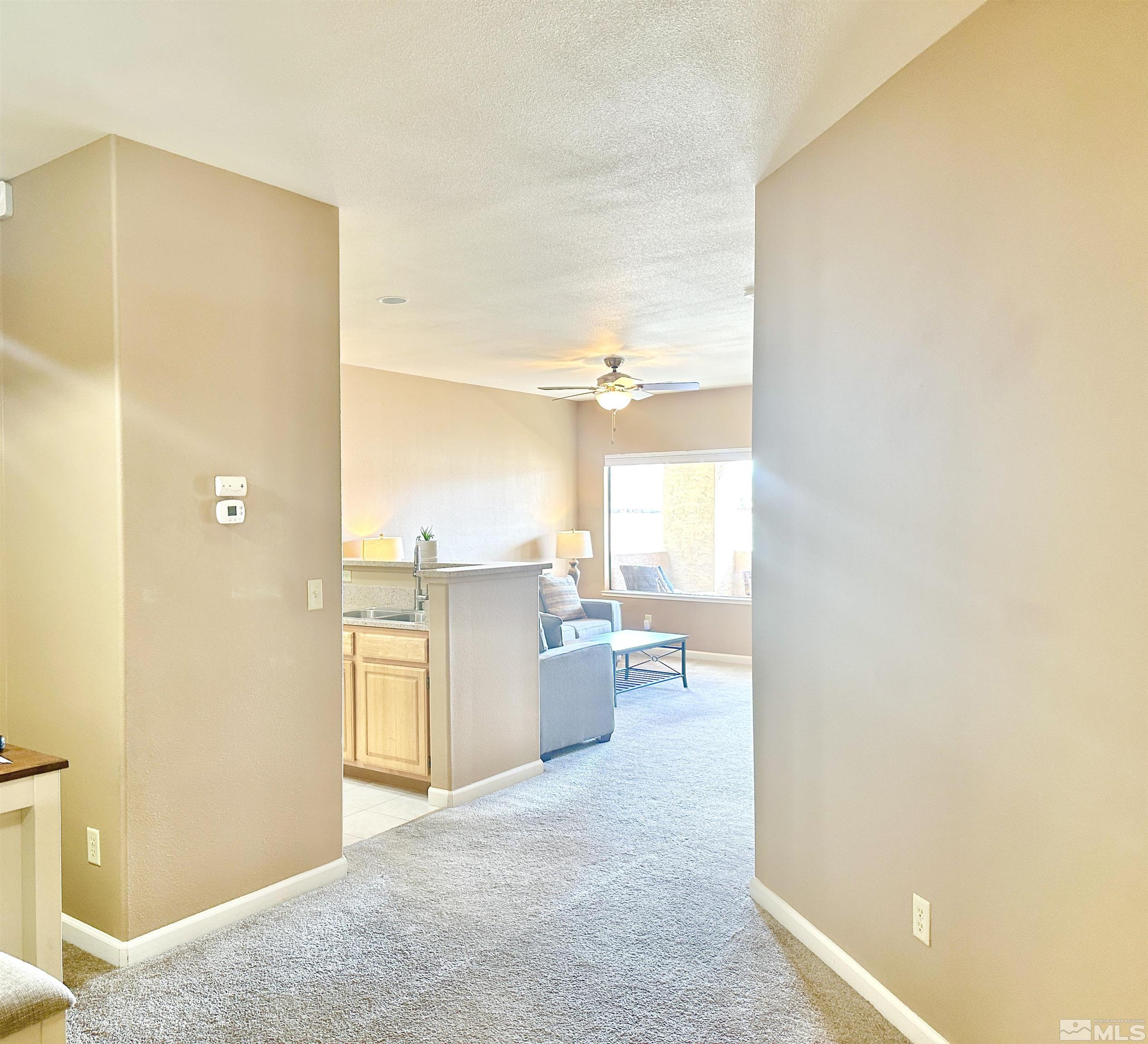 900 S Meadows, Unit 5122 Reno, NV 89521 - Photo 35 of 38 a view of a kitchen cabinets and a window