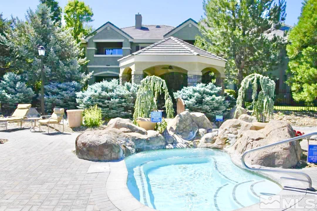 900 S Meadows, Unit 5122 Reno, NV 89521 - Photo 6 of 38 a view of a chairs and table in backyard