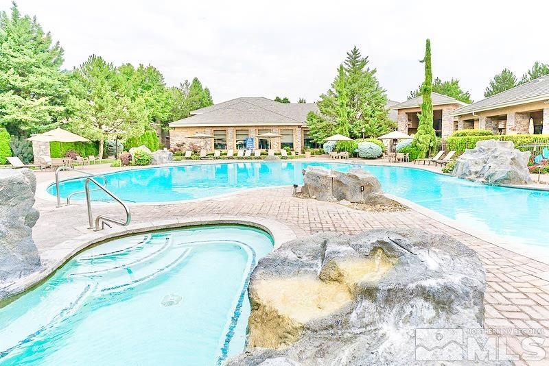 900 S Meadows, Unit 5122 Reno, NV 89521 - Photo 8 of 38 a view of swimming pool with a garden and deck