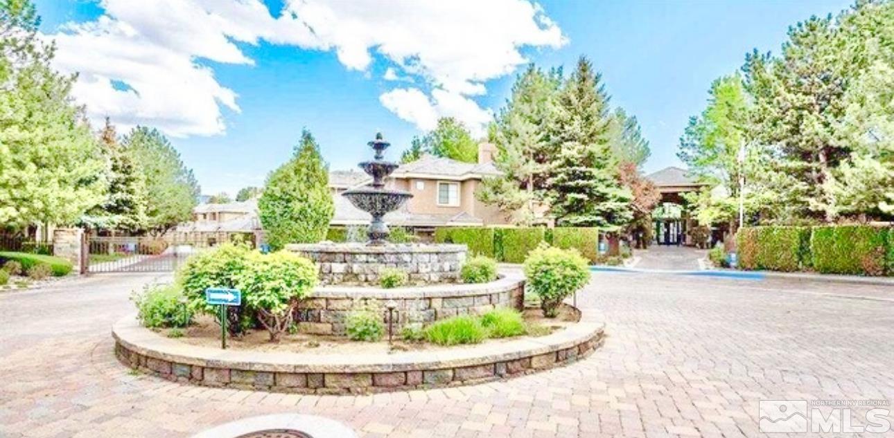 900 S Meadows, Unit 5122 Reno, NV 89521 - Photo 9 of 38 a view of a garden with a fountain