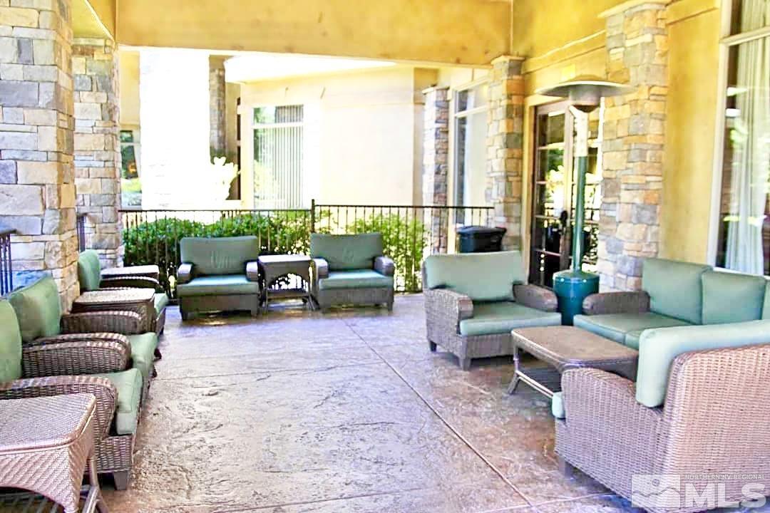 900 S Meadows, Unit 5122 Reno, NV 89521 - Photo 10 of 38 a living room with furniture and a large window