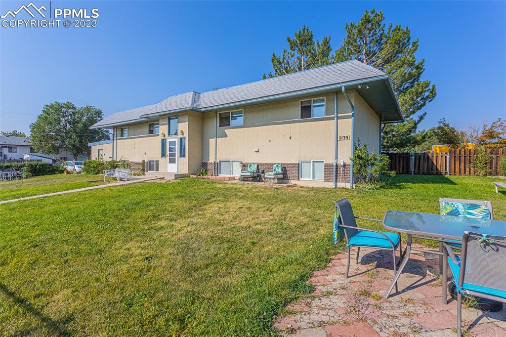 2139 Preuss Road, Unit C Colorado Springs, CO 80910 - Photo 13 of 14 a view of a house with a yard