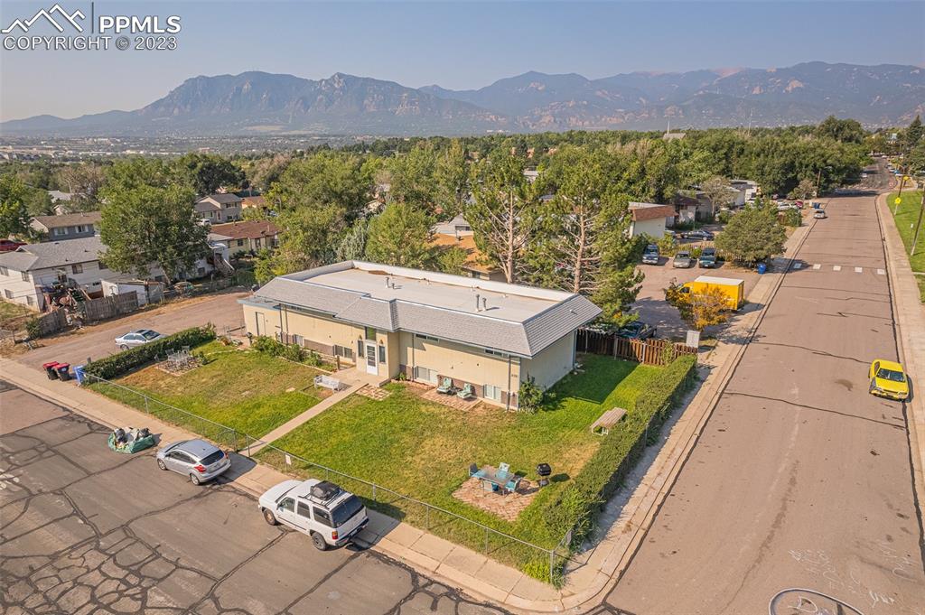 2139 Preuss Road, Unit C Colorado Springs, CO 80910 - Photo 14 of 14 a view of a balcony with an outdoor seating yard and mountain view