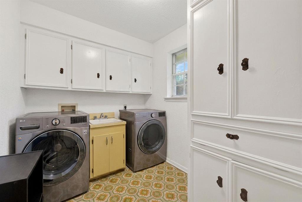 1415 South Joe Wilson Road Cedar Hill, TX 75104 - Photo 15 of 17 a view of a storage and utility room with washer and dryer