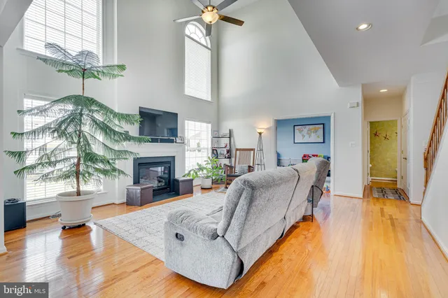 a living room with furniture fireplace and a flat screen tv