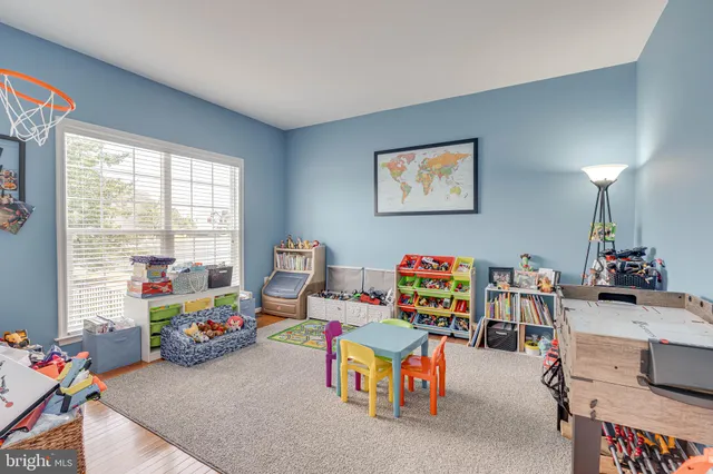 image of a living room with furniture and a flat screen tv