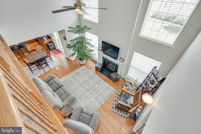 a bedroom with a bed a dresser and a flat screen tv
