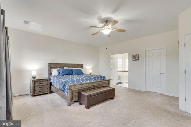 a bathroom with a tub a window and a shower