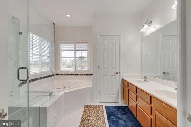 a bedroom with a bed and a book shelf