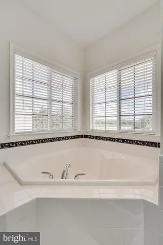 a bedroom with a bed furniture and a window