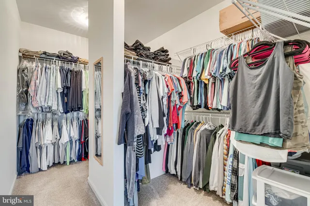 a bedroom with a bed and a night stand