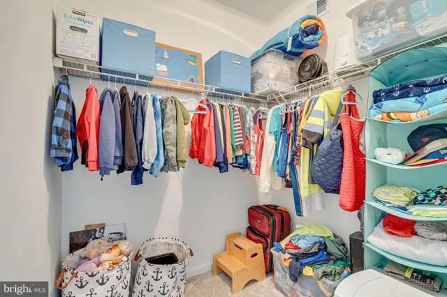 a living room with furniture and a bed