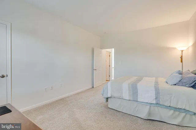 a view of a swimming pool and lounge chairs