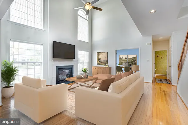 a living room with fireplace furniture and a flat screen tv