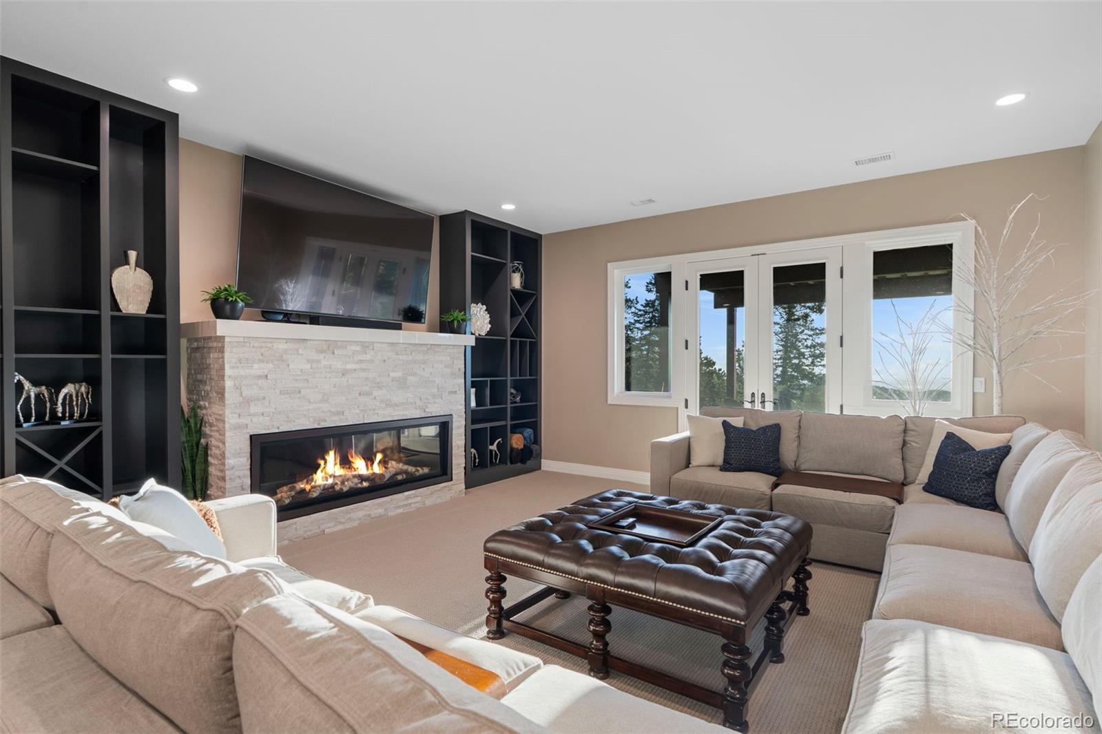 730 Genesee Mountain Road Golden, CO 80401 - Photo 33 of 50 a living room with furniture and a fireplace