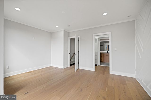 a view of a bathroom from a corridor