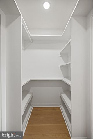 a bathroom with a granite countertop shower a sink and a stove