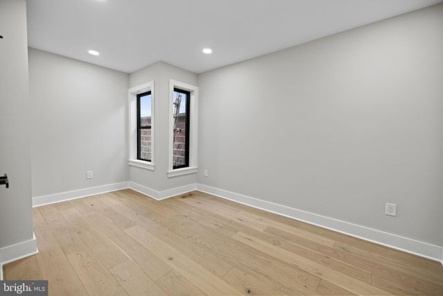 a view of a hallway with washer and dryer