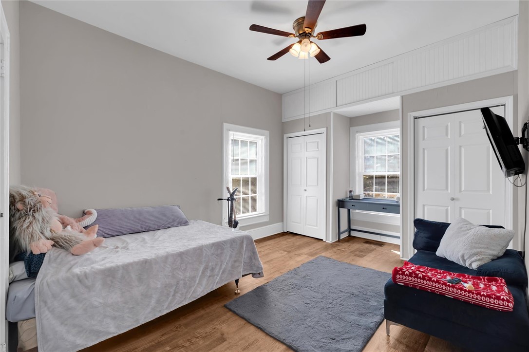 309 Hill Street Easley, SC 29640 - Photo 16 of 25 This inviting bedroom features rich hardwood flooring and abundant natural light.