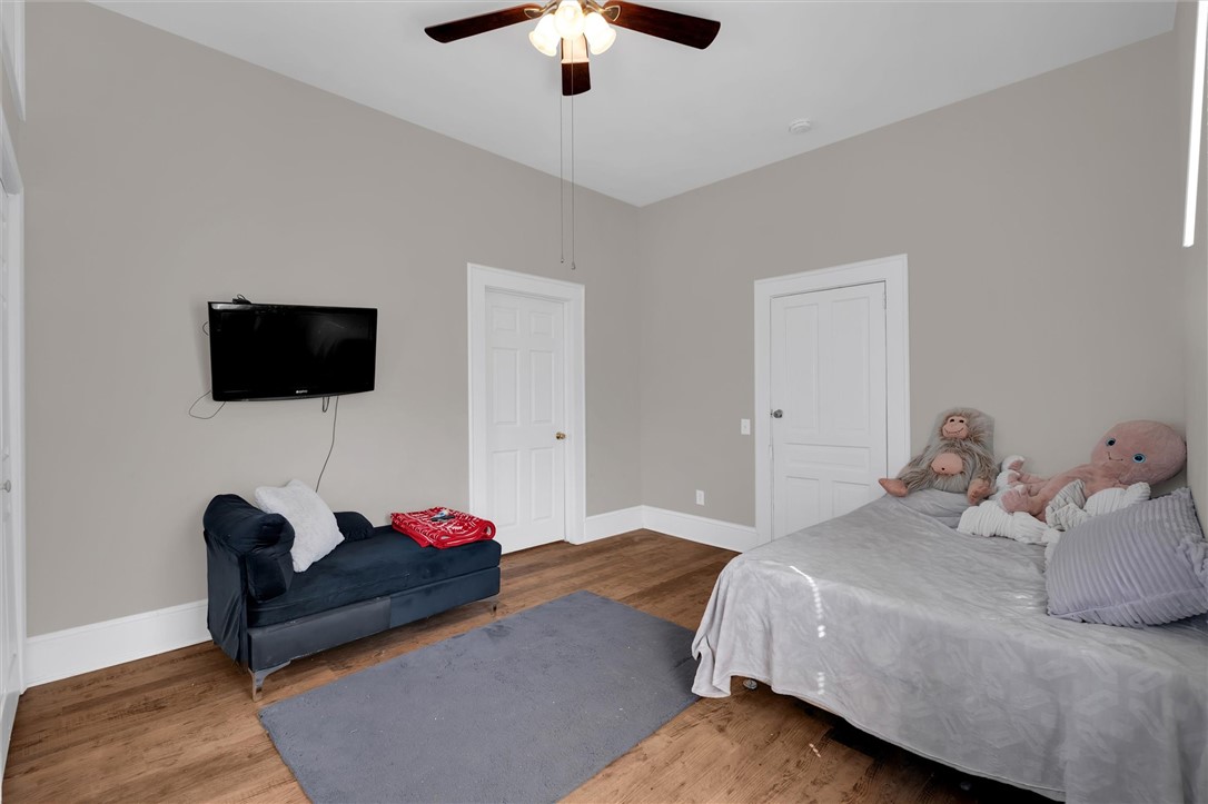 309 Hill Street Easley, SC 29640 - Photo 17 of 25 This cozy room offers comfortable living with warm flooring and a cooling ceiling fan.