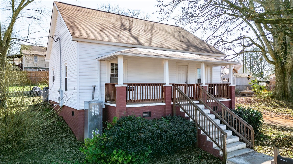 309 Hill Street Easley, SC 29640 - Photo 3 of 25 This cozy home offers a charming porch, perfect for relaxing evenings.