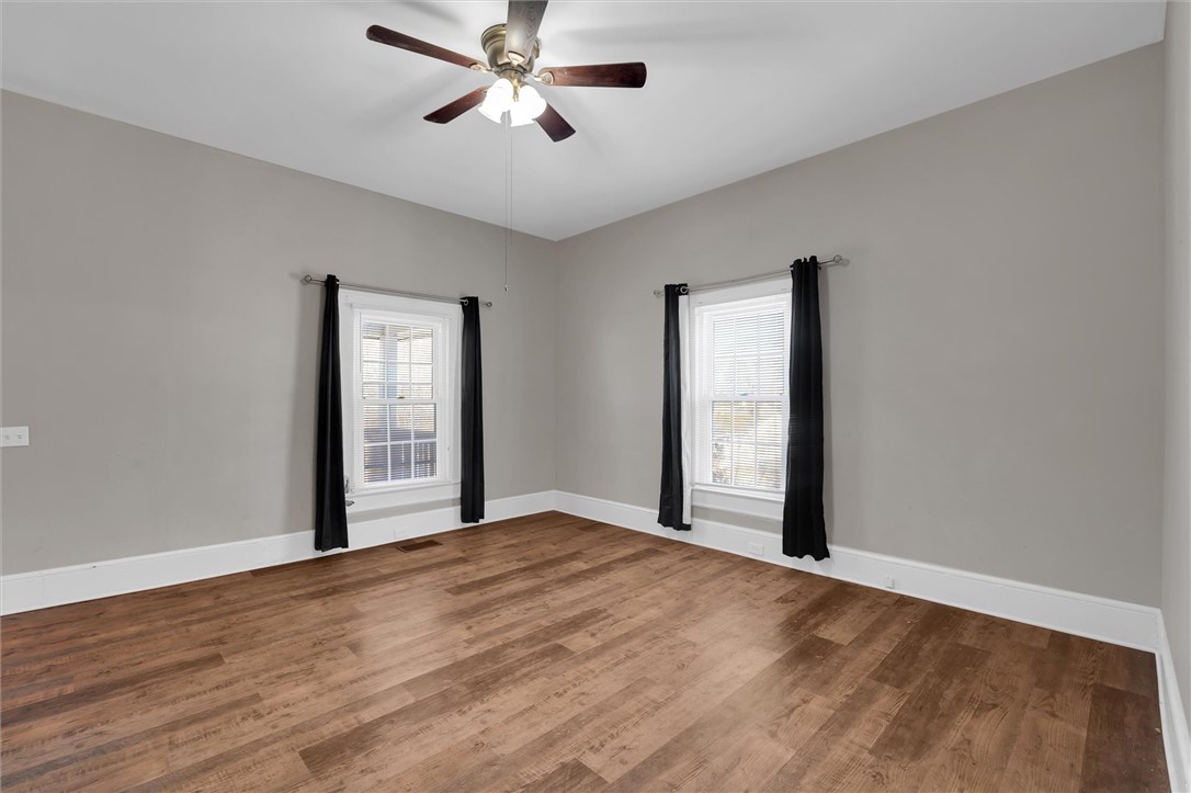 309 Hill Street Easley, SC 29640 - Photo 8 of 25 This spacious room features ample natural light and durable wood flooring.
