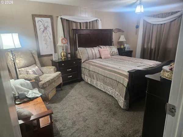 a bedroom with a bed and a couch