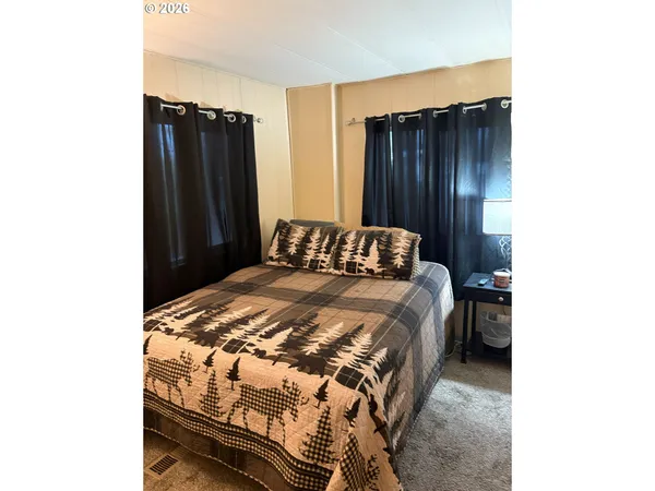 a bedroom with a bed and a closet