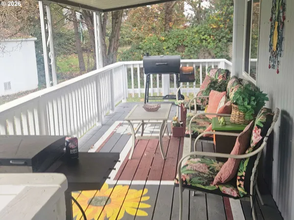 a view of balcony with furniture and wooden deck