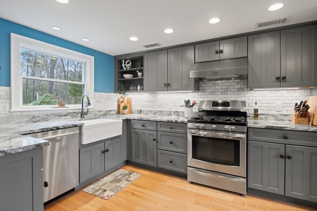 2045 Main Street Barnstable, MA 02648 - Photo 11 of 41 a kitchen with stainless steel appliances granite countertop a stove and a sink