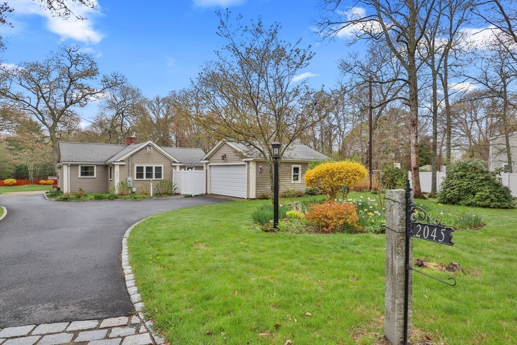 2045 Main Street Barnstable, MA 02648 - Photo 20 of 41 a view of a house with backyard and trees