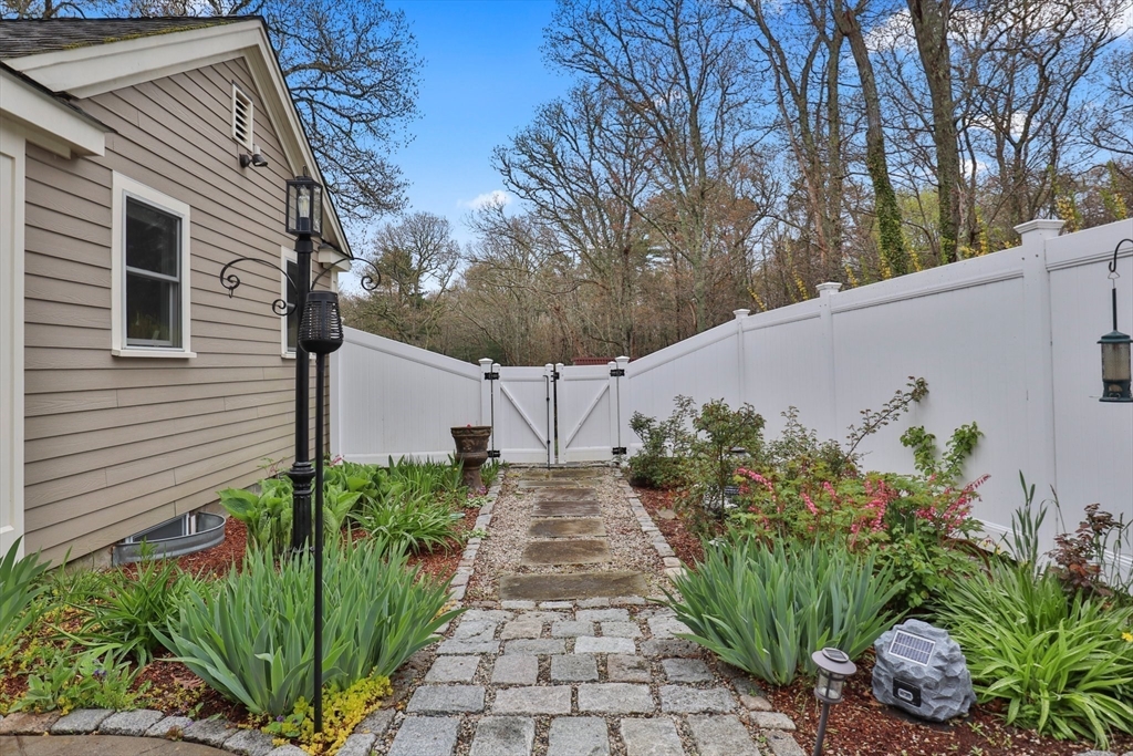 2045 Main Street Barnstable, MA 02648 - Photo 21 of 41 a house with garden in front of it