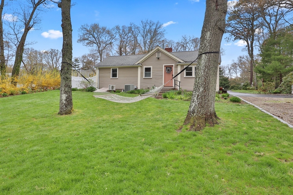2045 Main Street Barnstable, MA 02648 - Photo 25 of 41 a front view of a house with garden