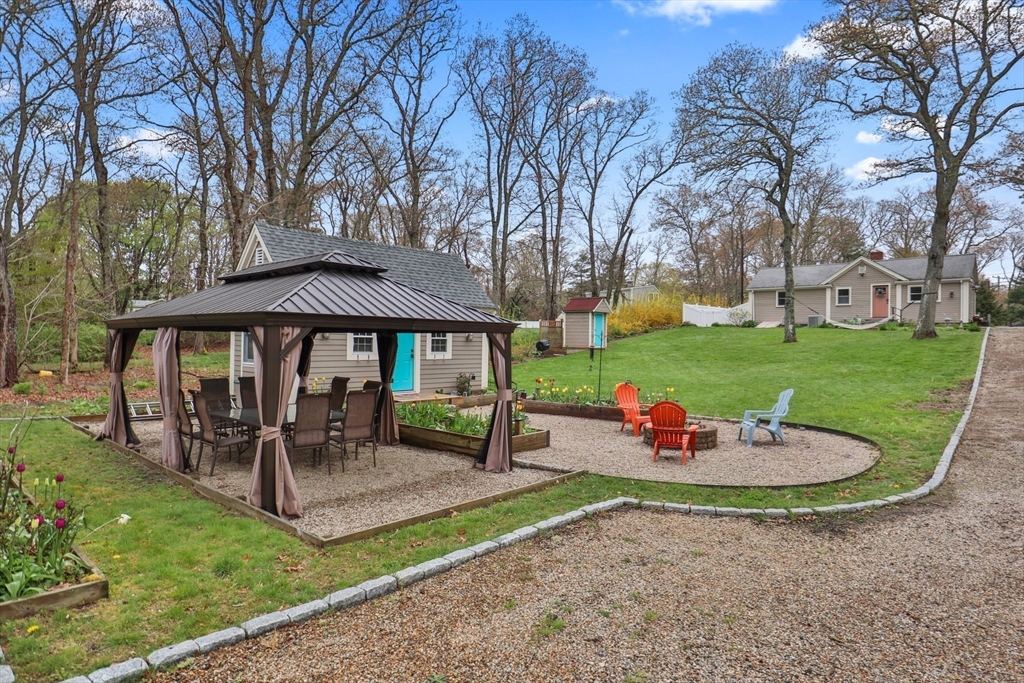 2045 Main Street Barnstable, MA 02648 - Photo 27 of 41 a view of a house with backyard and sitting area