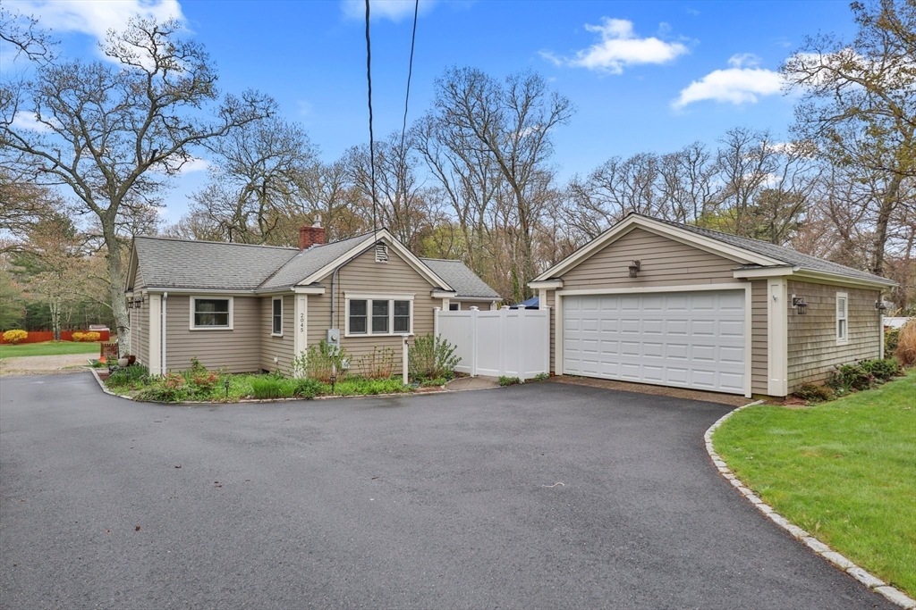 2045 Main Street Barnstable, MA 02648 - Photo 29 of 41 a view of a house with a yard and large tree