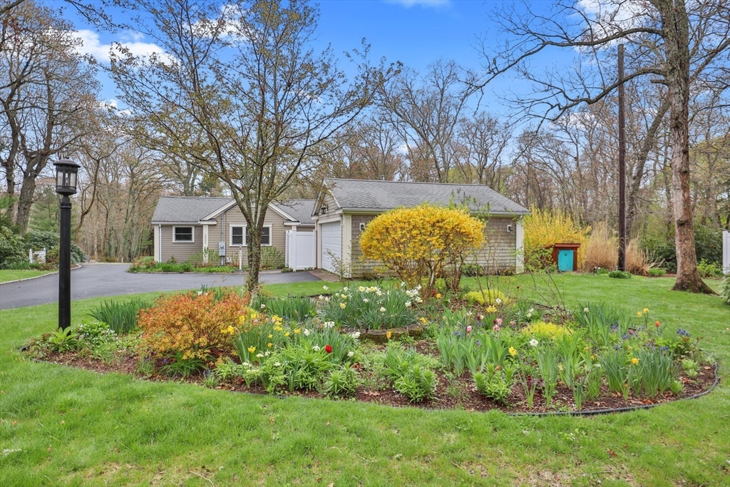 2045 Main Street Barnstable, MA 02648 - Photo 30 of 41 a front view of a house with garden