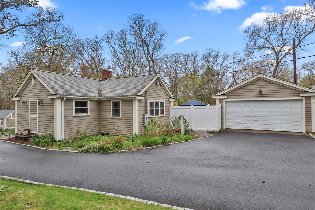 2045 Main Street Barnstable, MA 02648 - Photo 31 of 41 a view of a house with a yard and large tree