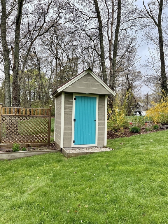 2045 Main Street Barnstable, MA 02648 - Photo 34 of 41 a front view of a house with a garden