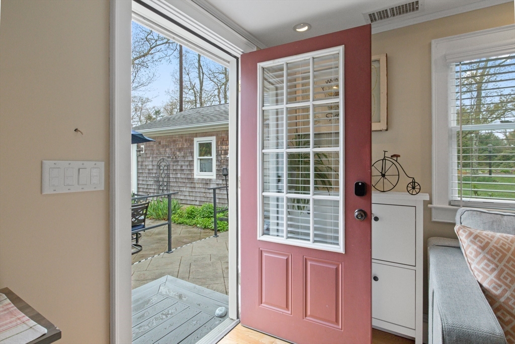 2045 Main Street Barnstable, MA 02648 - Photo 5 of 41 a view of a door and chair in the balcony
