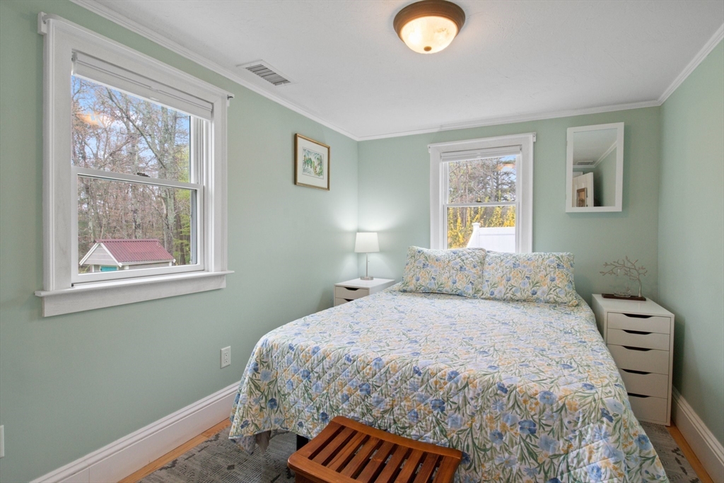 2045 Main Street Barnstable, MA 02648 - Photo 8 of 41 a bedroom with a bed and a window