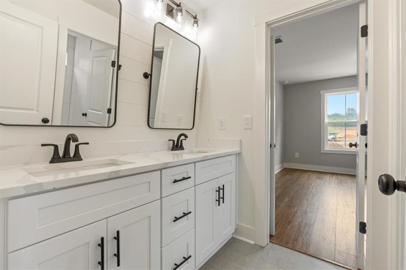131 Old Alabama Road Southeast Emerson, GA 30137 - Photo 29 of 44 a bathroom with a sink and a mirror