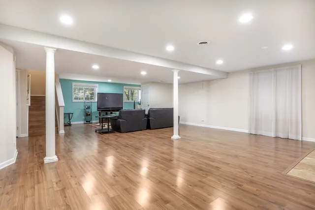 a view of livingroom with furniture wooden floor and window