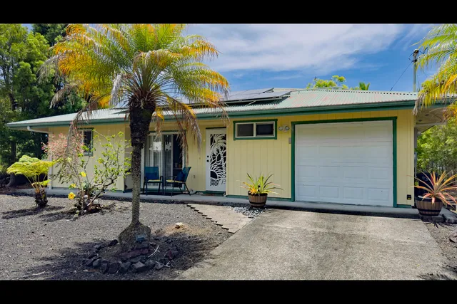 a front view of house with outdoor seating