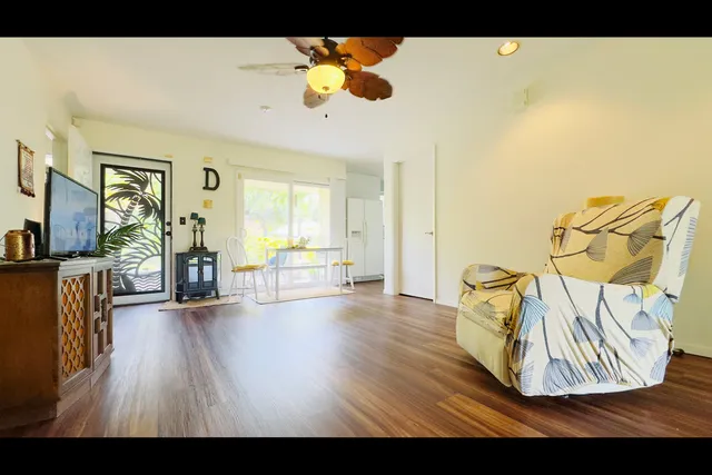 a view of a livingroom with furniture and a flat screen tv