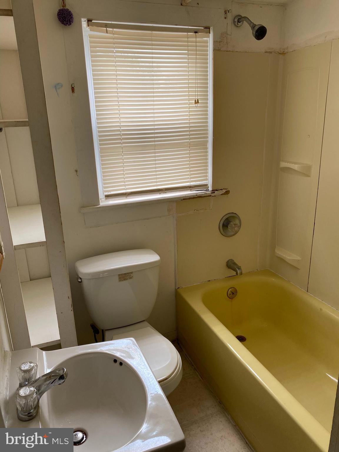 704 Bridgeboro Street Riverside, NJ 08075 - Photo 13 of 13 a bathroom with a sink and a bathtub