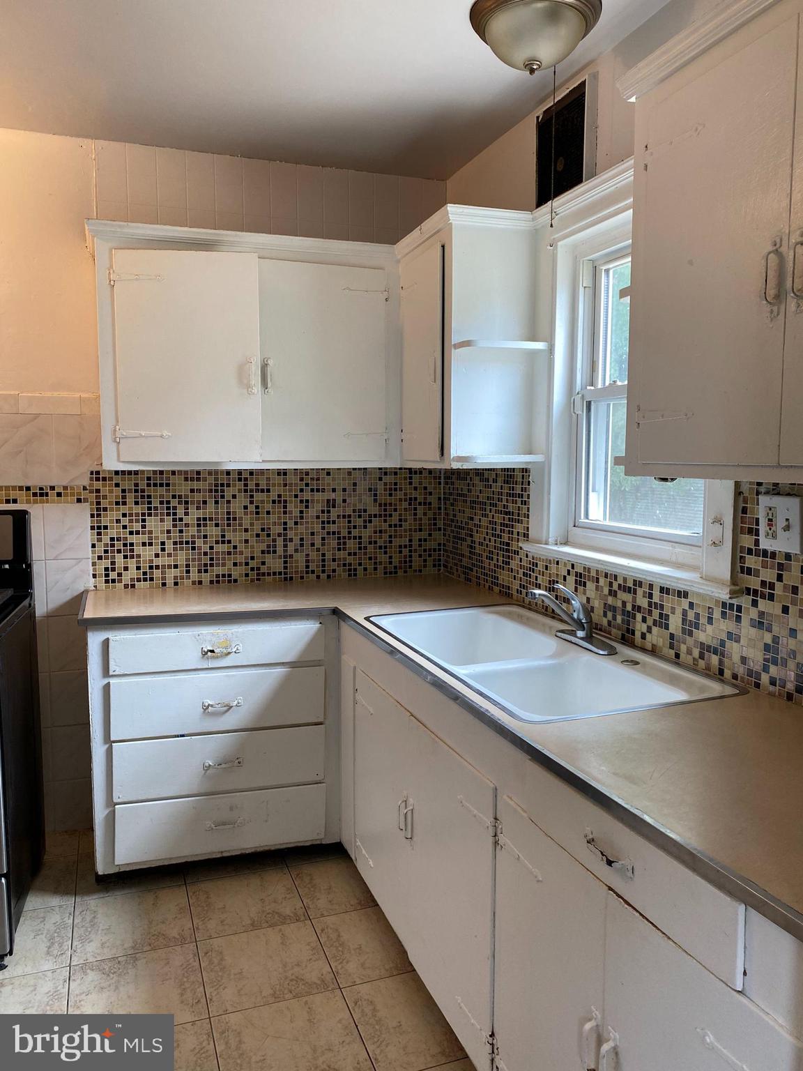 704 Bridgeboro Street Riverside, NJ 08075 - Photo 5 of 13 a bathroom with a sink and a mirror
