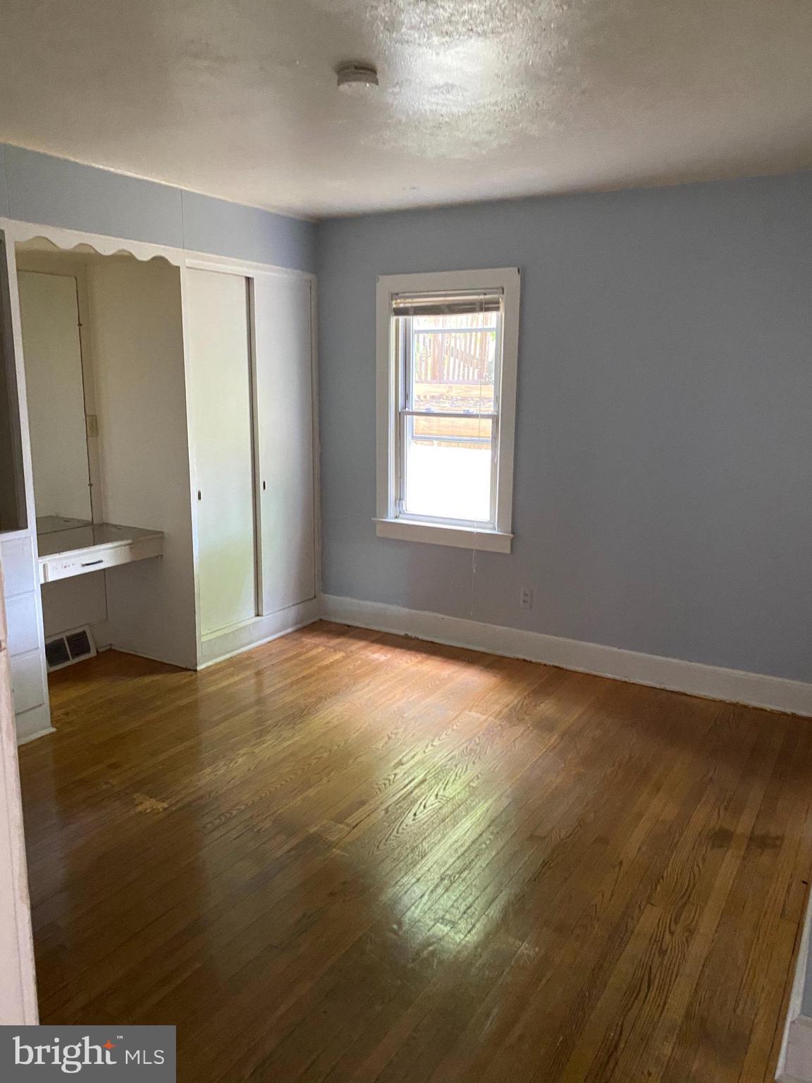 704 Bridgeboro Street Riverside, NJ 08075 - Photo 8 of 13 a view of an empty room with a window