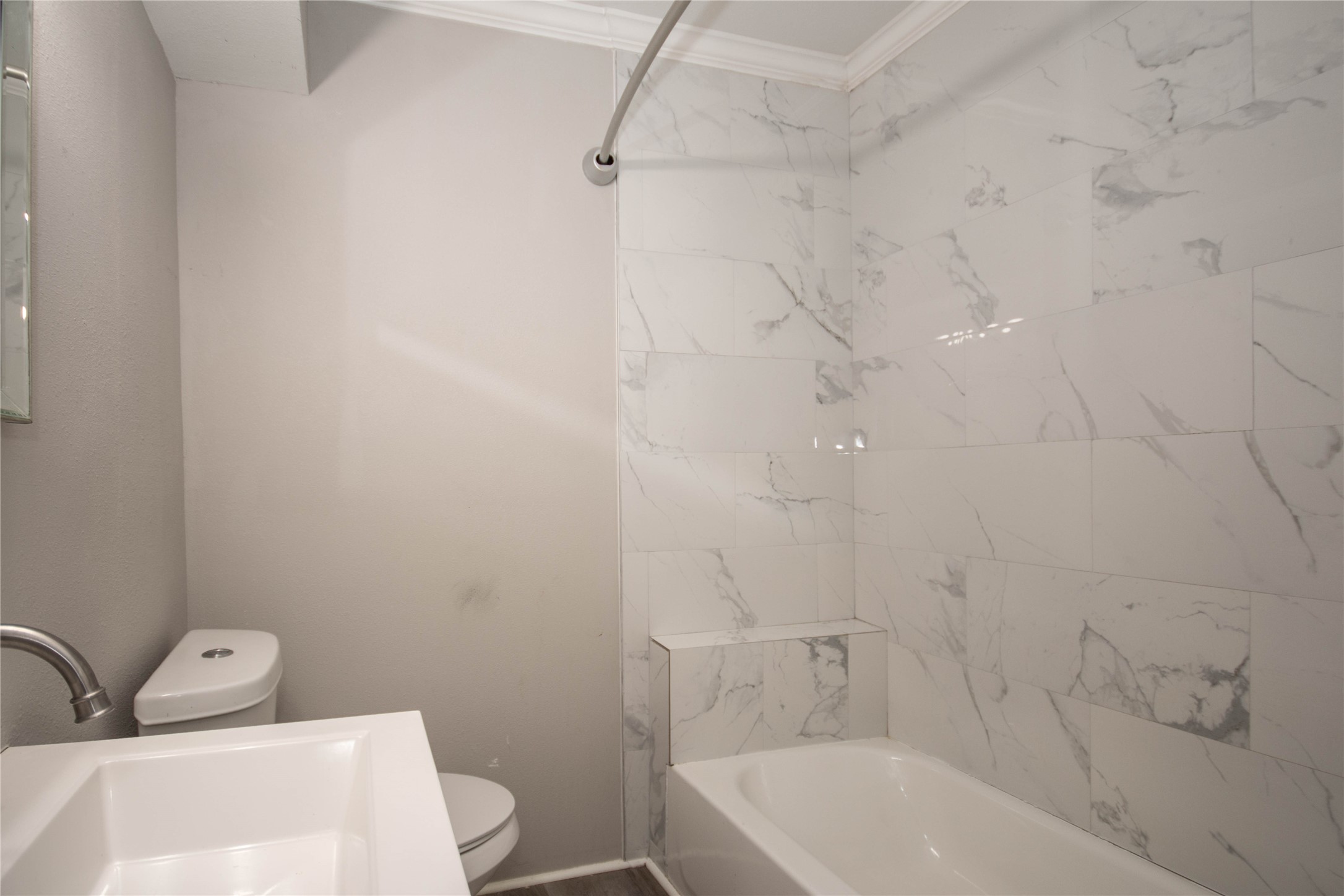 3412 Rosedale Street Houston, TX 77004 - Photo 11 of 26 a bathroom with a sink a toilet and bathtub