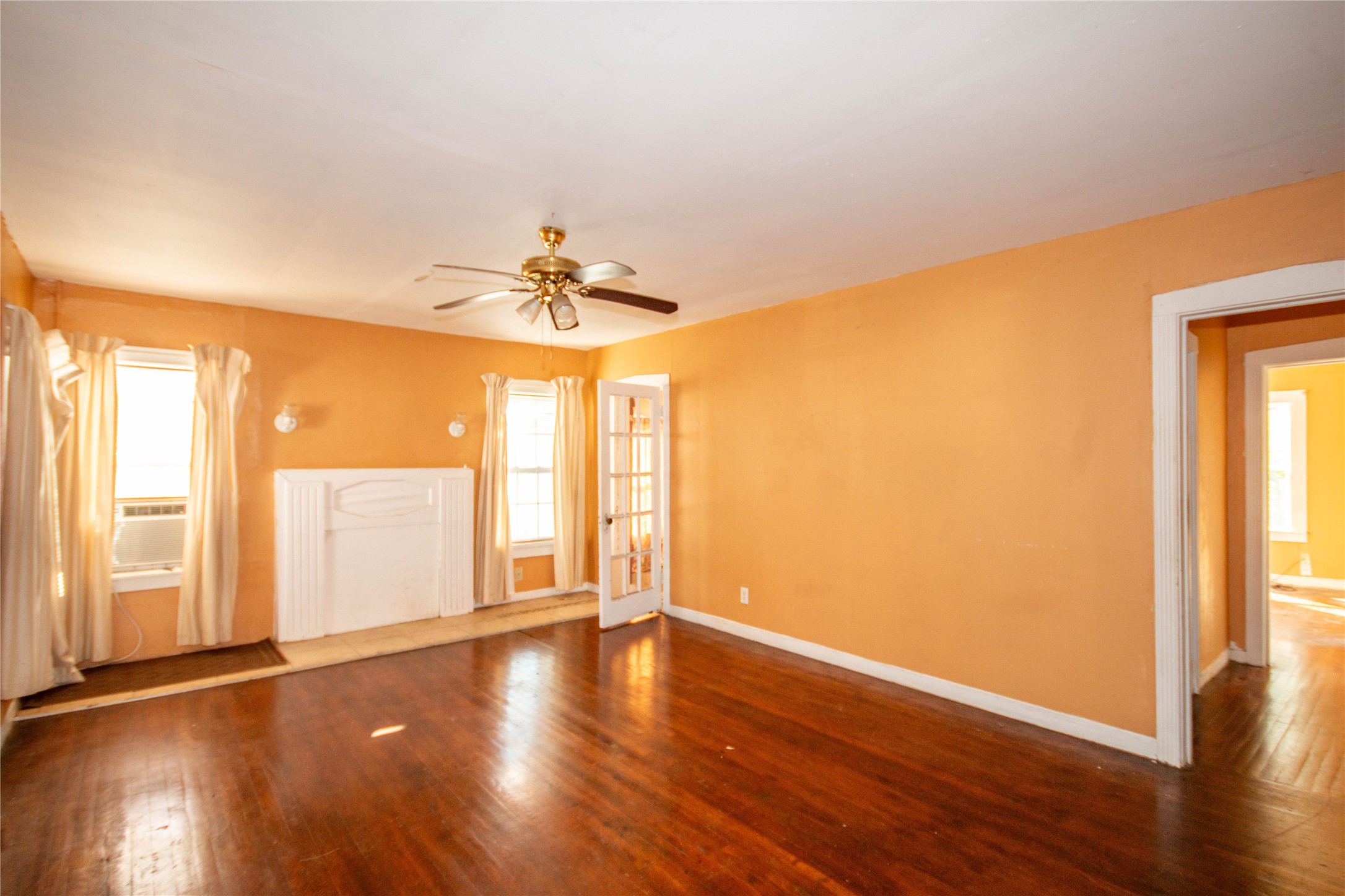 3412 Rosedale Street Houston, TX 77004 - Photo 14 of 26 a view of an empty room with wooden floor and a window